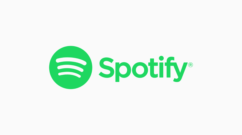 Grünes Spotify-Logo und Text vor hellgrauem Hintergrund